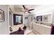 Primary bathroom featuring a jetted tub, tiled shower, and dual sinks with granite countertops at 253 Pine Valley Dr, Powder Springs, GA 30127