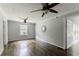 Spacious bedroom featuring hardwood floors, a ceiling fan, and lots of natural light at 253 Pine Valley Dr, Powder Springs, GA 30127