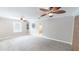 Spacious bedroom with plush carpet, ceiling fans, and a large window for natural light at 253 Pine Valley Dr, Powder Springs, GA 30127