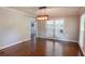 Bright dining room with hardwood floors, modern light fixture, and lots of natural light at 253 Pine Valley Dr, Powder Springs, GA 30127