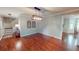 Charming dining room with hardwood floors, decorative light fixture, and elegant wall decor at 253 Pine Valley Dr, Powder Springs, GA 30127