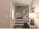 Inviting entryway with staircase, light-colored walls, decorative accents, and natural light at 253 Pine Valley Dr, Powder Springs, GA 30127