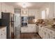 Bright kitchen featuring stainless steel appliances, granite countertops, and lots of cabinet space at 253 Pine Valley Dr, Powder Springs, GA 30127
