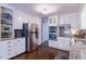 Bright kitchen with granite countertops, stainless steel appliances, and ample cabinet space at 253 Pine Valley Dr, Powder Springs, GA 30127