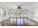 Sunroom with a multitude of windows, hardwood floors, and an abundance of natural light at 253 Pine Valley Dr, Powder Springs, GA 30127