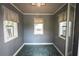Cozy, compact room featuring three windows with natural light and neutral-toned walls at 253 Pine Valley Dr, Powder Springs, GA 30127