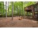 Backyard featuring a deck, bridge, seating area and a fire pit, creating an inviting outdoor space at 3573 Bramwell Nw Xing, Kennesaw, GA 30144
