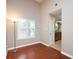 Bright bedroom with hardwood floors and ample natural light from a large window at 3573 Bramwell Nw Xing, Kennesaw, GA 30144