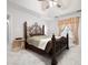 Main bedroom with large decorative bed frame and an ensuite bathroom entrance at 3573 Bramwell Nw Xing, Kennesaw, GA 30144