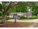 Community clubhouse featuring well-manicured lawns and a private property sign at 3573 Bramwell Nw Xing, Kennesaw, GA 30144