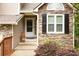 Welcoming entryway featuring a stone facade, a bright window, and a well-maintained front door at 3573 Bramwell Nw Xing, Kennesaw, GA 30144