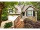 Charming home featuring stone accents, a cozy front porch, and a well-maintained landscaped yard at 3573 Bramwell Nw Xing, Kennesaw, GA 30144