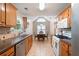 Bright kitchen with stainless steel dishwasher, tile backsplash, and a breakfast nook at 3573 Bramwell Nw Xing, Kennesaw, GA 30144