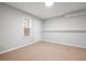 Spacious carpeted room with a view, providing a blank canvas for customization and ample space at 3573 Bramwell Nw Xing, Kennesaw, GA 30144