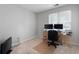 Spacious carpeted room with a window and door, offering versatility for various uses and natural light at 3573 Bramwell Nw Xing, Kennesaw, GA 30144