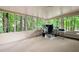 Bright sunroom with views of lush trees, creating a serene workspace at 3573 Bramwell Nw Xing, Kennesaw, GA 30144