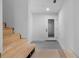 Unfinished basement stairs leading to a door; ready for your personal touches at 3904 Bakers Ferry Sw Rd, Atlanta, GA 30331
