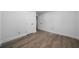 Simple, bright bedroom with wood-look floors, white walls, and ample natural light, ready for personalization at 3904 Bakers Ferry Sw Rd, Atlanta, GA 30331