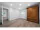 Bedroom featuring hard wood floors, natural light, with a wardrobe, and access to other rooms at 3904 Bakers Ferry Sw Rd, Atlanta, GA 30331