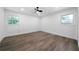Bright, airy bedroom with sleek flooring, two windows and a modern ceiling fan, ready for personalization at 3904 Bakers Ferry Sw Rd, Atlanta, GA 30331