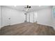 Spacious bedroom with modern flooring, a ceiling fan, and ample natural light from large windows at 3904 Bakers Ferry Sw Rd, Atlanta, GA 30331