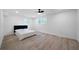 Bright bedroom with two windows, ceiling fan and light wood-look floors at 3904 Bakers Ferry Sw Rd, Atlanta, GA 30331