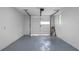 Clean and organized garage with white walls and painted floor, ready for parking and storage at 3904 Bakers Ferry Sw Rd, Atlanta, GA 30331