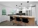Modern kitchen with white cabinets, wooden countertops, and stainless steel appliances at 3904 Bakers Ferry Sw Rd, Atlanta, GA 30331
