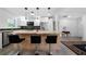 Spacious kitchen island with counter seating, stainless steel appliances and white cabinets at 3904 Bakers Ferry Sw Rd, Atlanta, GA 30331