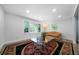 Inviting living room with large windows, an area rug, and recessed lighting at 3904 Bakers Ferry Sw Rd, Atlanta, GA 30331