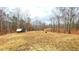 Expansive backyard with treeline and storage building; great for outdoor activities at 7460 Highway 101 N, Rockmart, GA 30153