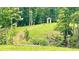 Backyard featuring trees, deer, and a decorative pergola at 7460 Highway 101 N, Rockmart, GA 30153