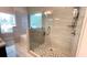 Modern bathroom featuring a glass-enclosed shower with tiled walls and flooring at 7460 Highway 101 N, Rockmart, GA 30153