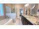 Well-appointed bathroom with tub, walk-in shower, and double sink vanity at 7460 Highway 101 N, Rockmart, GA 30153