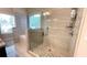 Modern bathroom featuring a glass-enclosed shower with stylish tiling and a separate tub at 7460 Highway 101 N, Rockmart, GA 30153