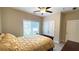 Bedroom featuring a ceiling fan, a double door closet, neutral decor, and comfortable furnishings at 7460 Highway 101 N, Rockmart, GA 30153