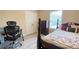 Inviting bedroom with a window, a desk, and a comfortable bed, perfect for relaxation and productivity at 7460 Highway 101 N, Rockmart, GA 30153