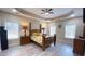 Spacious bedroom features a tray ceiling, ceiling fan, and large windows offering natural light at 7460 Highway 101 N, Rockmart, GA 30153