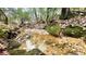 The creek features moss covered rocks and calm water running though the lush forest at 7460 Highway 101 N, Rockmart, GA 30153