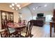 An open-concept home features a dining room with seating for six and modern luxury vinyl plank flooring at 7460 Highway 101 N, Rockmart, GA 30153
