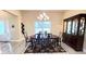 Formal dining room featuring an oval table, decorative rug, chandelier, and a wooden china cabinet at 7460 Highway 101 N, Rockmart, GA 30153
