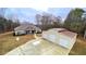 Spacious home with a large detached garage, lush trees and large driveway at 7460 Highway 101 N, Rockmart, GA 30153