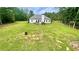 Wide backyard featuring a white home with dark roof at 7460 Highway 101 N, Rockmart, GA 30153