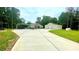 Charming home featuring a circular driveway, covered parking, and a detached garage nestled among lush trees at 7460 Highway 101 N, Rockmart, GA 30153