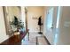 Inviting foyer featuring a mirrored accent table, coat rack, and a glass-paneled front door for a bright entry at 7460 Highway 101 N, Rockmart, GA 30153