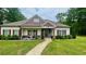 Charming exterior with well-maintained landscaping and a cozy front porch at 7460 Highway 101 N, Rockmart, GA 30153