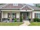 Charming front porch with stone accents and rocking chairs at 7460 Highway 101 N, Rockmart, GA 30153