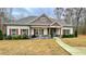 Charming home with manicured lawn and stone accents on the porch columns at 7460 Highway 101 N, Rockmart, GA 30153