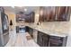 Modern kitchen featuring stainless steel appliances, dark cabinetry, and granite countertops at 7460 Highway 101 N, Rockmart, GA 30153
