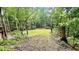 The property has a grassy, cleared area in the middle of a wooded lot at 7460 Highway 101 N, Rockmart, GA 30153